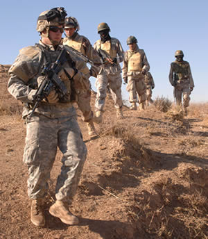 Soldiers from the U.S. Army's 101st Airborne Division and Iraqi Army searched for a weapons cache on a farm outside of Hawijah, Iraq, in 2006. 